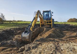 Baggerlader New Holland B115C
