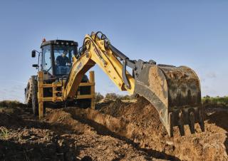 Baggerlader New Holland B115C