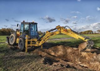 Baggerlader New Holland B115C